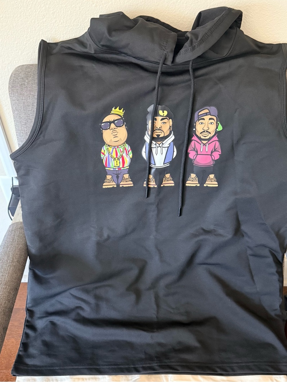 Black Sleeveless Hoodie with Colorful Cartoon Trio Graphic (pack of 4 shirts)